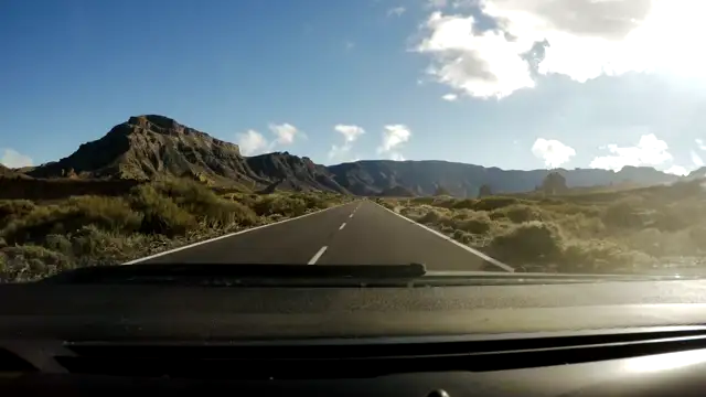 mixkit-pov-driving-along-straight-road-towards-mountains-48489-hd-ready