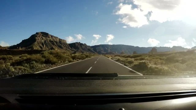 mixkit-pov-driving-along-straight-road-towards-mountains-48489-hd-ready